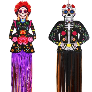 Day of the Dead skeleton hanging ornaments with colorful foil fringe and paper cutouts