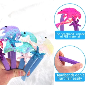 Detailed view of dolphin and starfish sequin headband with soft protective fabric finish