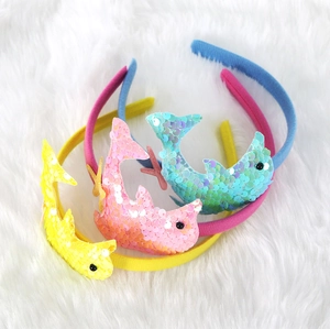 Sequin dolphin headbands for ocean theme parties in yellow pink and blue colors