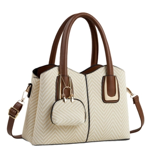 Straw woven tote bag with brown leather trim and detachable shoulder strap for women