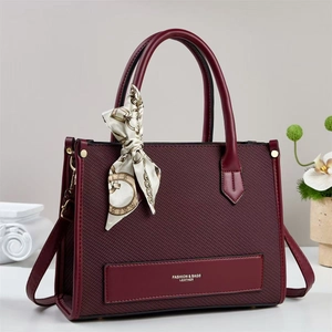Vintage burgundy woven leather tote bag with silk scarf accent and crossbody strap