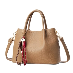 Brown litchi grain leather handbag with twin handles and woven rope key charm pendant