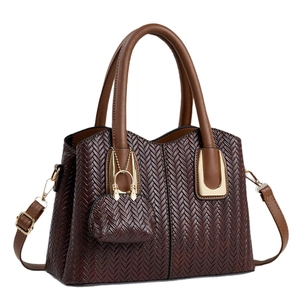 Deep brown woven leather tote bag with top handles and adjustable shoulder strap