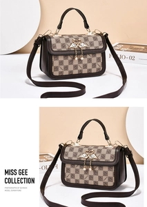 Macro shot of checkered crossbody bag with golden swan closure and pearl tassel detail