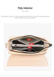 Detail view of the multi-compartment interior and grey lining of the beige crossbody bag
