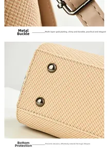 Detail of multi-layer gold plated clasp and metal protective studs on woven bag