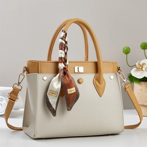 Chic two-tone lychee grain leather handbag with decorative scarf and gold buckle