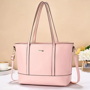 Chic pink leather tote bag with gold metal plate and adjustable long shoulder strap