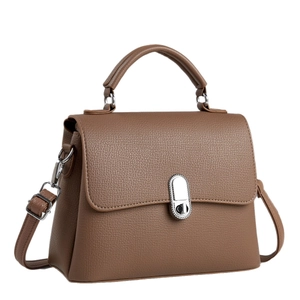 Brown pebbled leather crossbody bag with silver oval twist lock and top handle