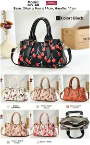 Detail view of cherry print handbag with dimensions 24cm width and internal storage layout