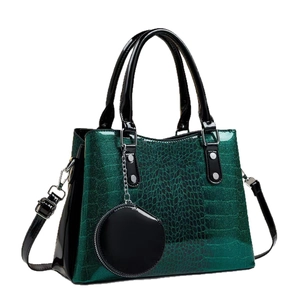 Borsa a mano verde scuro con paillettes e trama coccodrillo nera con piccolo borsellino
