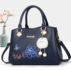Navy blue faux leather handbag for elderly women featuring exquisite floral embroidery