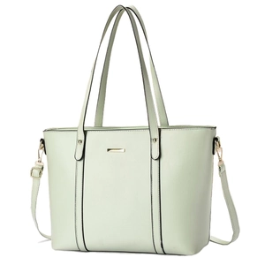 Minimalist mint green tote bag with golden metal trim and adjustable shoulder strap