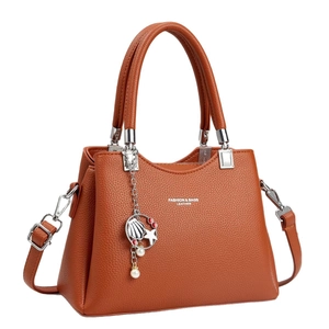 Orange brown litchi pattern leather tote bag with silver star pendant charms
