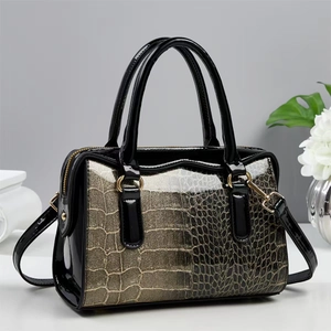 Elegant black patent leather Boston bag with gold crocodile texture and top handles