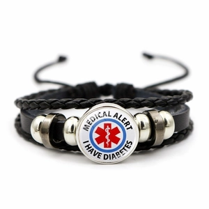 Detail of medical alert leather bracelet with I HAVE DIABETES charm and braided straps