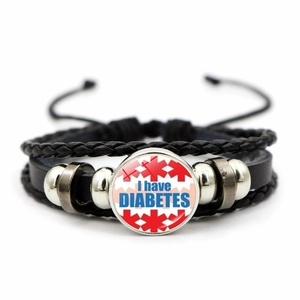 Close-up of adjustable braided medical bracelet with I have DIABETES glass alert charm