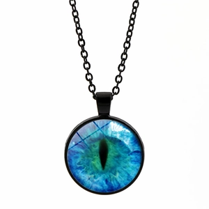 Detailed macro view of the mythical blue evil eye dragon pendant on a black chain