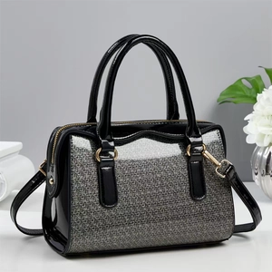 Elegant stone texture Boston bag with silver glitter front and black patent leather accents