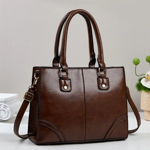 Dark brown high-quality faux leather tote bag with top handles and adjustable shoulder strap