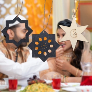 Close-up of wooden Ramadan ornaments with moon and star carvings for festive decor
