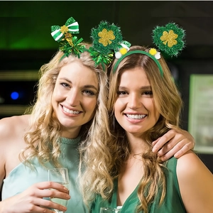 Close-up of Saint Patrick's Day headbands with green bows and sequin shamrocks