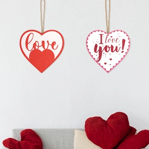 Detail of wooden heart ornaments with Love and I love you text for Valentine decoration
