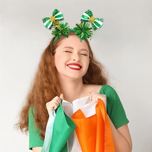 Detail of St. Patrick's Day headband with green bows, sequins and Irish flag props