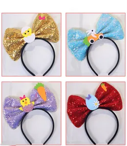 Detail of Easter sequin bow headbands featuring glitter chicks, rabbits and carrots