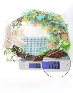 Easter wreath detail featuring colorful bunny motifs and a rustic burlap bow decoration
