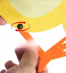 Close-up of rotatable joint mechanism on felt Easter chick ornament for DIY party decor