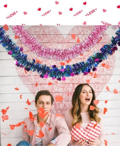 Romantic scene of heart garlands with colorful tinsel and shiny heart-shaped foil pendants