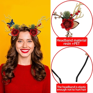 Christmas reindeer antler headband with festive red berries, pine needles, and blue butterfly