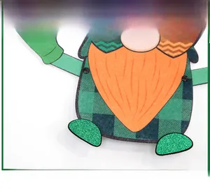 Detail of St. Patrick's Day gnome ornament with green glitter and plaid pattern