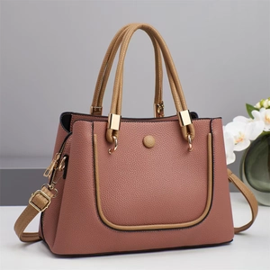Chic pink and brown contrast shoulder bag with pebble grain leather and gold hardware