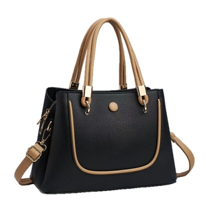 Black and khaki contrast leather handbag with pebble texture and gold hardware