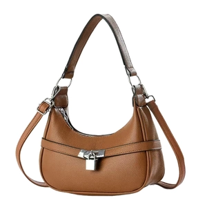 Brown lychee leather crescent hobo bag with top handle and adjustable strap