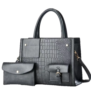 Luxurious black crocodile embossed tote bag set with detachable strap and golden hardware