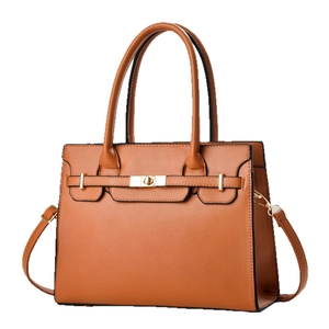 Classic caramel brown leather handbag with gold lock and adjustable shoulder strap