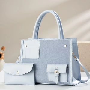 Chic baby blue large capacity tote bag with matching pouch and stylish shadow background