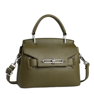 Minimalist olive green pebble leather handbag with silver turn-lock and crossbody strap