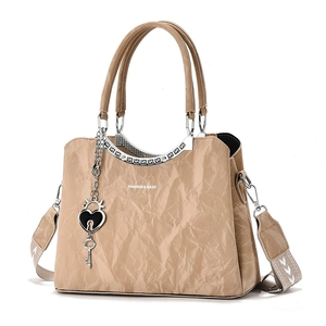 Fashionable khaki pleated handbag with geometric printed wide strap and heart lock charm