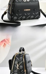 Vorderansicht der schwarzen Leder-Umhängetasche mit HSJ-Logo und Goldbeschlägen