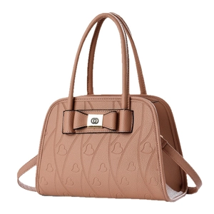 Brown leather handbag with heart pattern, large bow decoration and dual top handles
