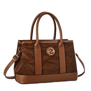 Classic brown leather tote bag with unique pleated texture and adjustable shoulder strap