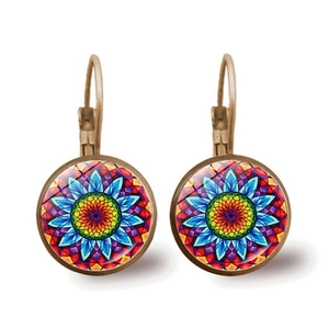 Detail view of bronze mandala lever-back earrings with colorful glass flower cabochons