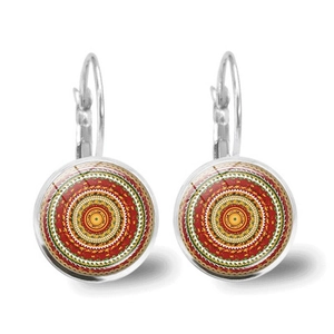 Detailed shot of mandala glass cabochon earrings with bohemian geometric pattern