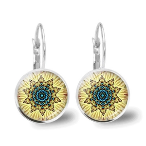Detailed macro view of silver mandala earrings featuring colorful geometric glass cabochons
