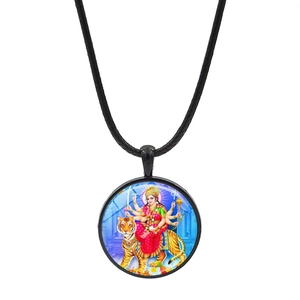 Close-up of Hindu Goddess Durga glass pendant on a black woven cord necklace cord