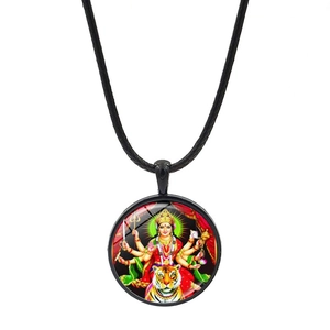 Detail view of Durga Hindu goddess pendant with black cord necklace and intricate artwork